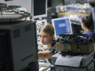 Female technicians working in a hospital repairshop for medical devices