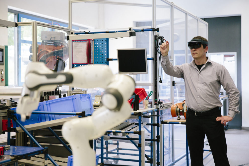 industry 4.0: engineer works with a head-mounted display