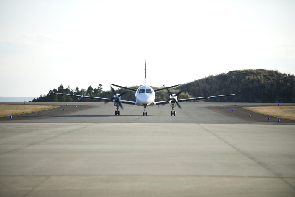 A propeller-driven plane(model:DASH8-400),arriving from Kagoshima to Tanegashima.