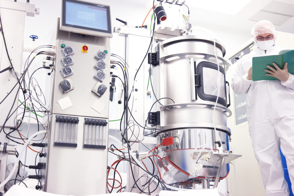 Scientist working with a bioreactor for cell culture